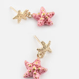 Boucles d'oreilles pendantes étoile de mer rose