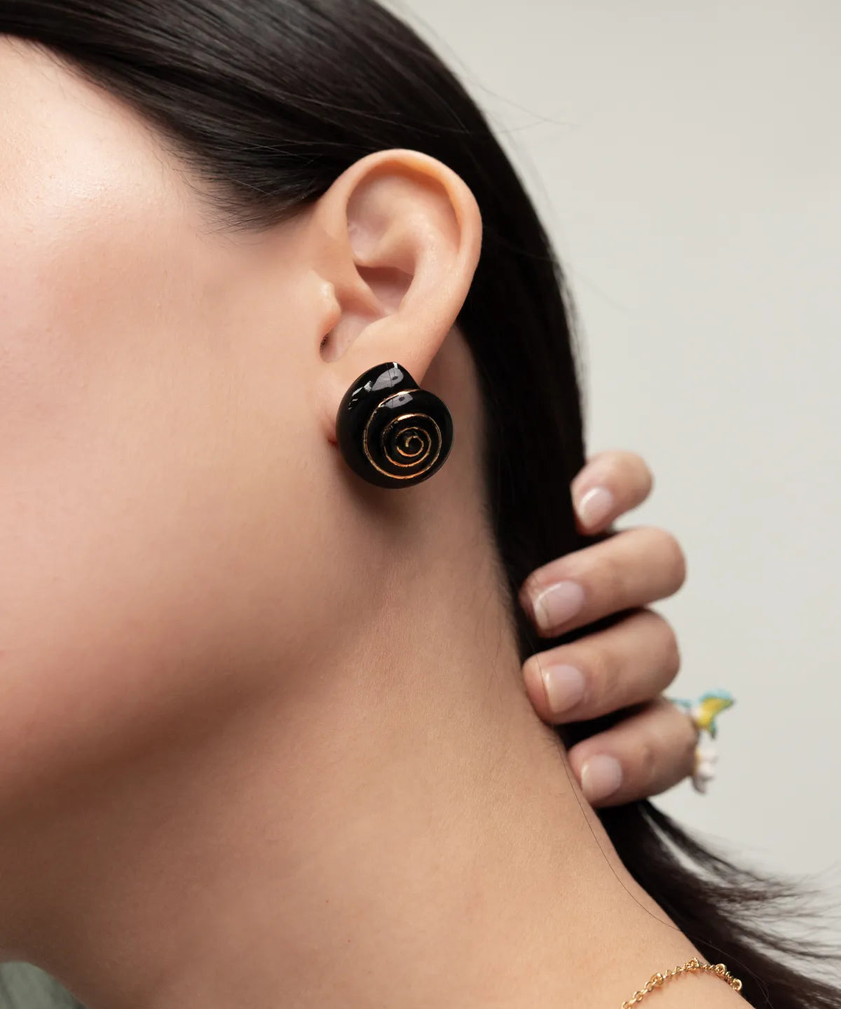 Black snail stud earrings