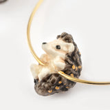 Hanging hedgehog hoop earrings