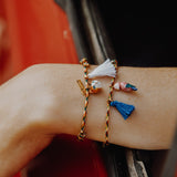 Bracelet corde oiseau pompon