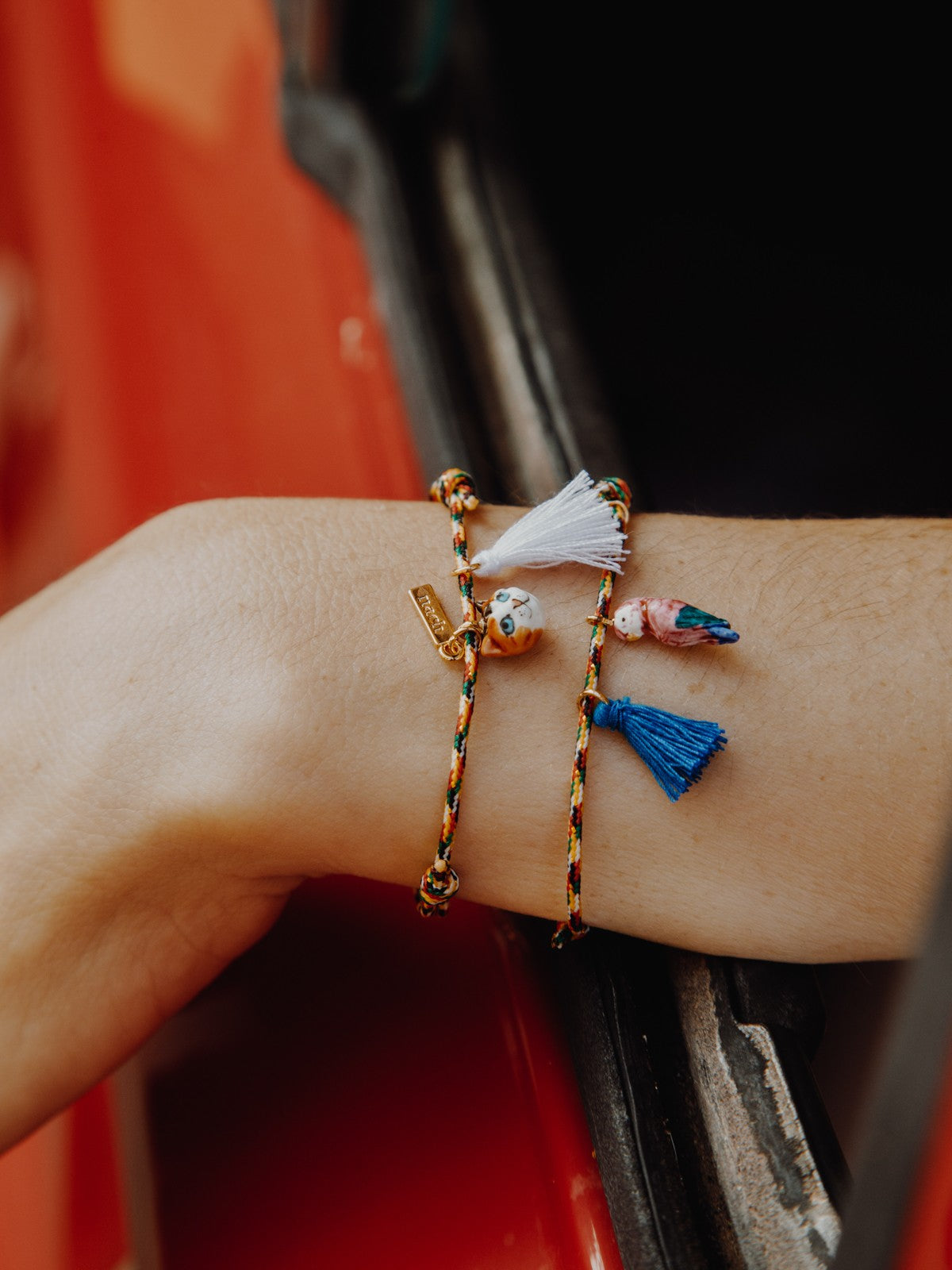 Bracelet corde oiseau pompon