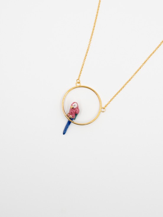 round gold necklace with pink and blue parrot
