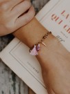 Bracelet perroquet violet avec pompon