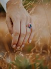 Adjustable gold ring with pink and blue parrot