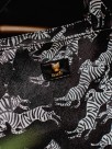faux leather week-end bag with hand painted animal porcelain details and zebra print