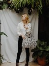 faux leather week-end bag with hand painted porcelain details  and leopard print