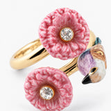 Anillo de pájaro y cardos rosas