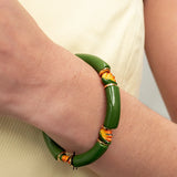 Bracelet perles vertes oiseau de paradis