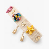 Beige braided bracelet with charms