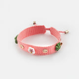 Pink braided bracelet with charms