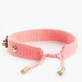 Pink braided bracelet with charms