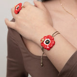 Red anemone iridescent cord bracelet