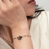Bracelet perles fleur d'Erine noire
