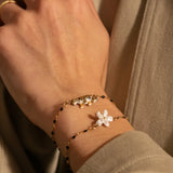 Bracelet perles et fleur blanches