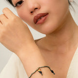 hematite bead and toucan bracelet