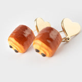 Heart and chocolate croissant ear studs
