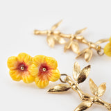 Double hibiscus and leaf drop earrings