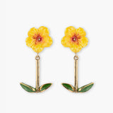 Boucles d’oreilles pendantes hibiscus et feuilles