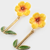 Boucles d’oreilles pendantes hibiscus et feuilles
