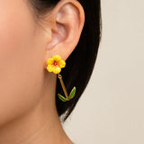 Boucles d’oreilles pendantes hibiscus et feuilles
