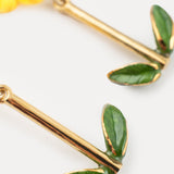 Boucles d’oreilles pendantes hibiscus et feuilles