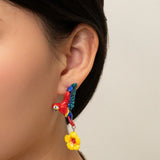 Flying parrot and hibiscus drop earrings