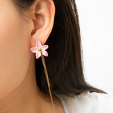 Boucles d’oreilles lys rose à franges
