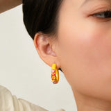Yellow floral hoop earrings