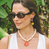Flying parrot and hibiscus drop earrings