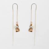 Longues boucles d'oreilles léopard