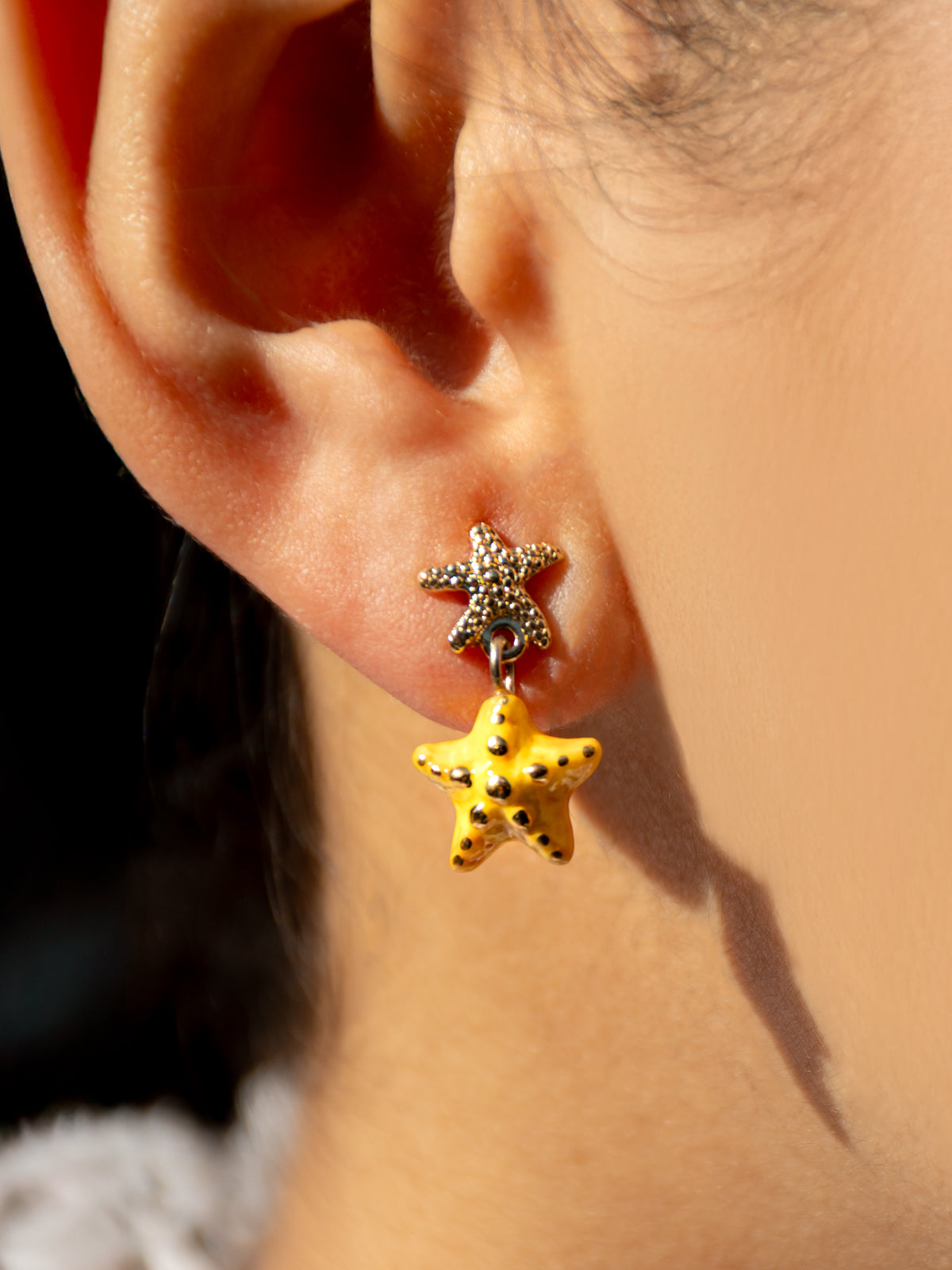 Yellow starfish dangle earrings