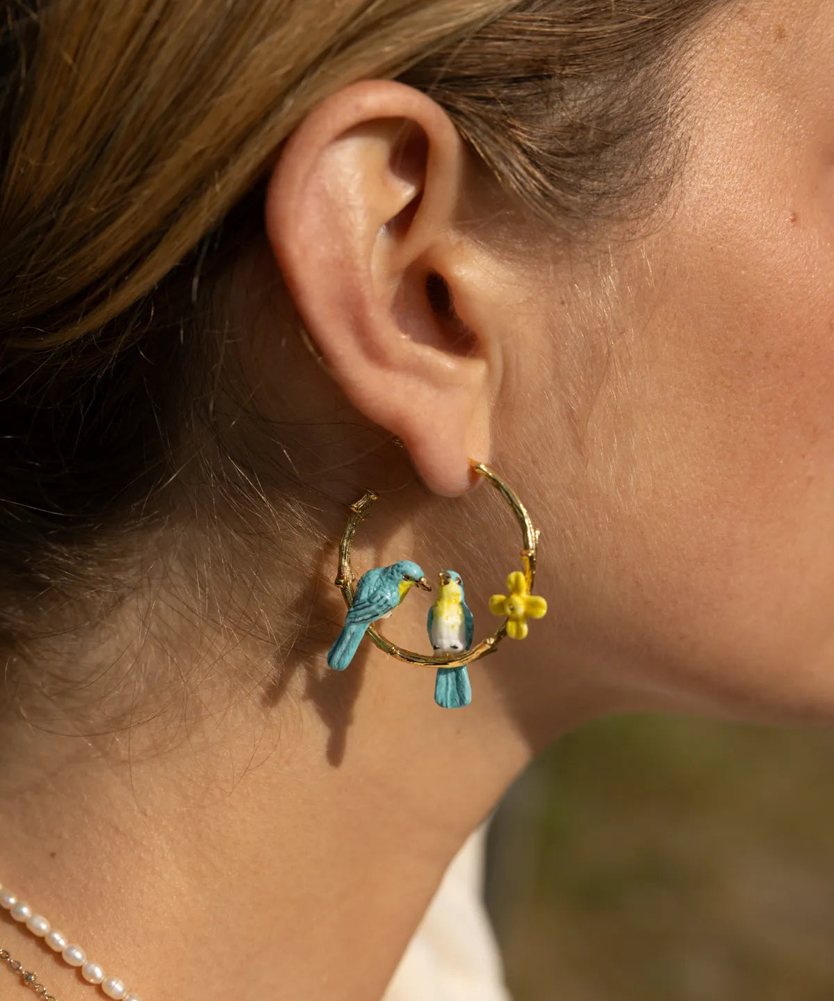Lovebird and daffodil branch earrings