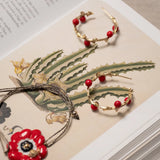 Red berry branch earrings