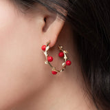 Red berry branch earrings