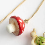 Long mushroom and snail earrings