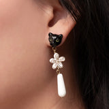 Boucles d'oreilles pendantes panthère et fleur d'Erine