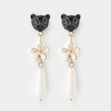 Boucles d'oreilles pendantes panthère et fleur d'Erine