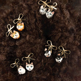 Tabby cat head and bow dangle earrings