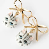Tabby cat head and bow dangle earrings