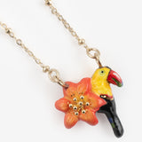 Collier lys et toucan