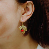 boucles d'oreilles dorées feuille et coccinelle nach