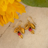 boucles d'oreilles dorées feuille et coccinelle nach