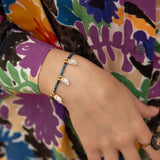 Bracelet en perles d'hématite et chouettes