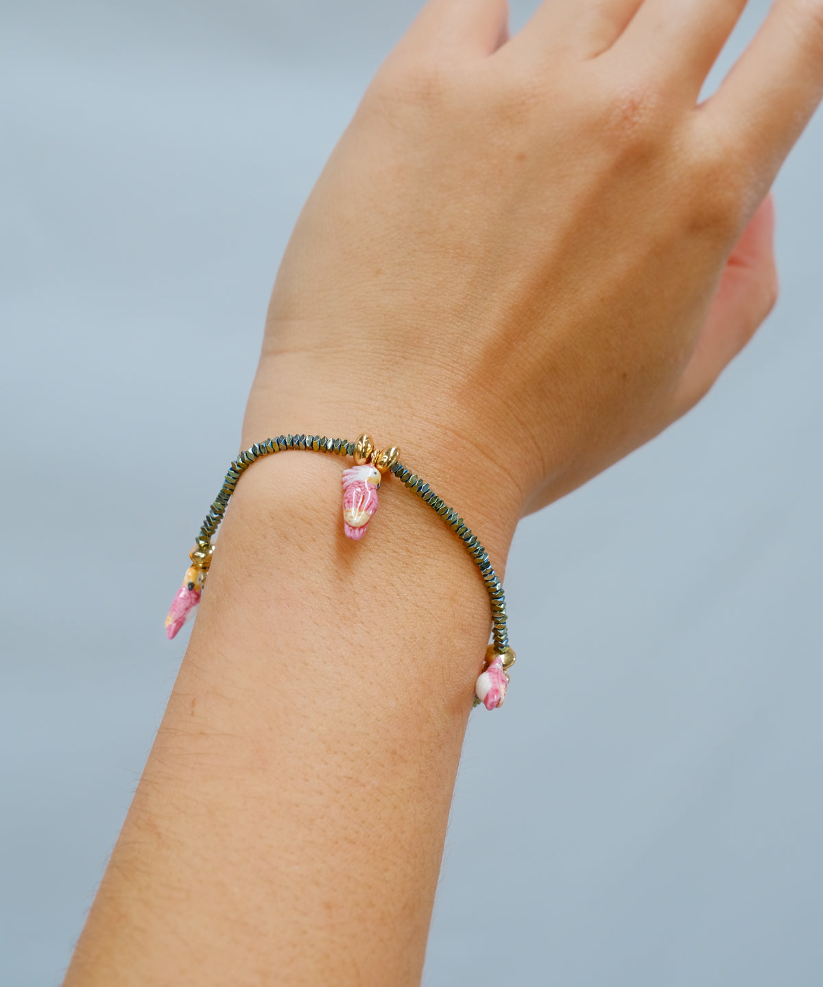 Bracelet perles d'hématite & cacatoès