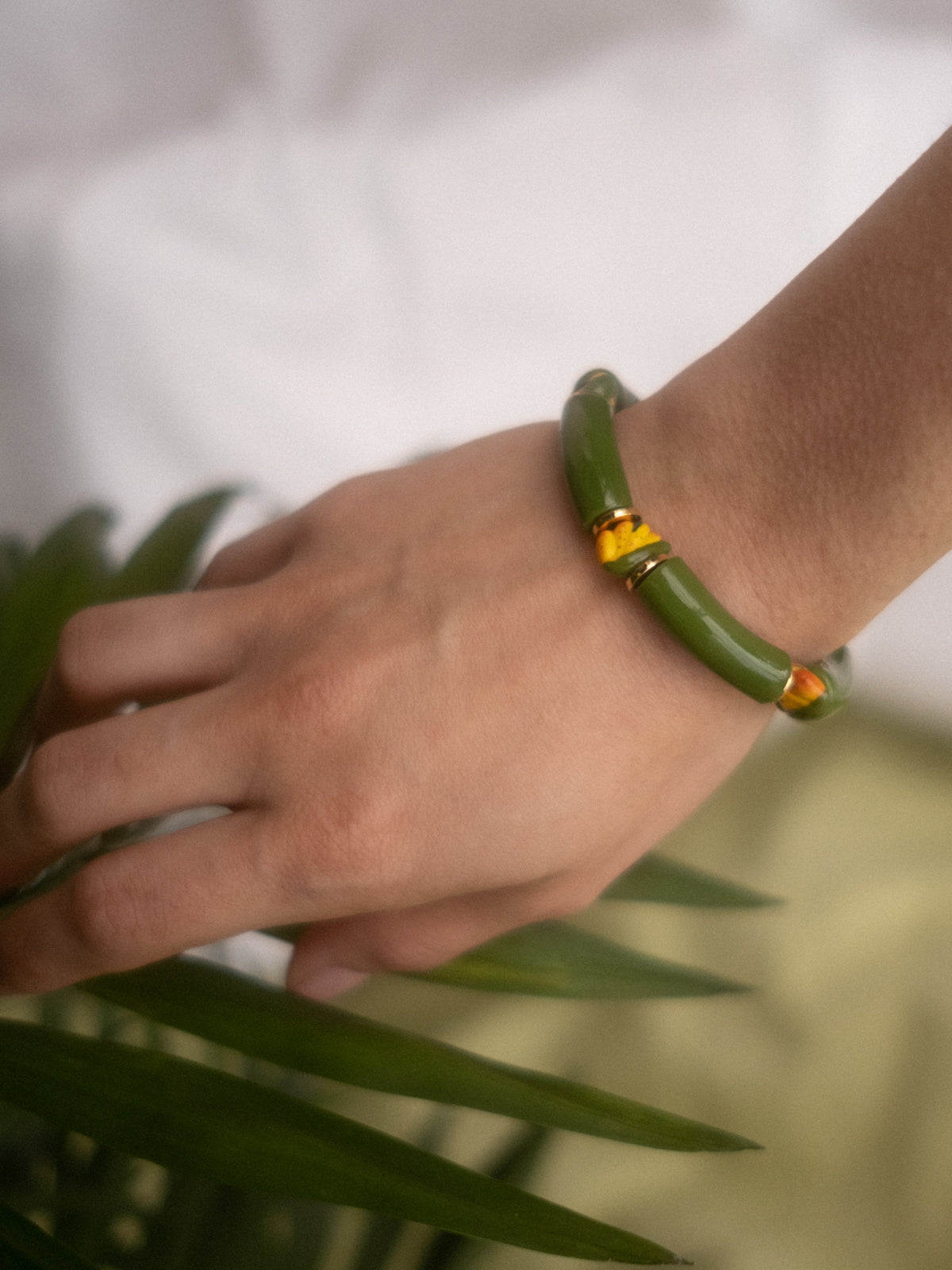 Bracelet perles vertes oiseau de paradis