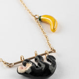 Collier capucin sur branche