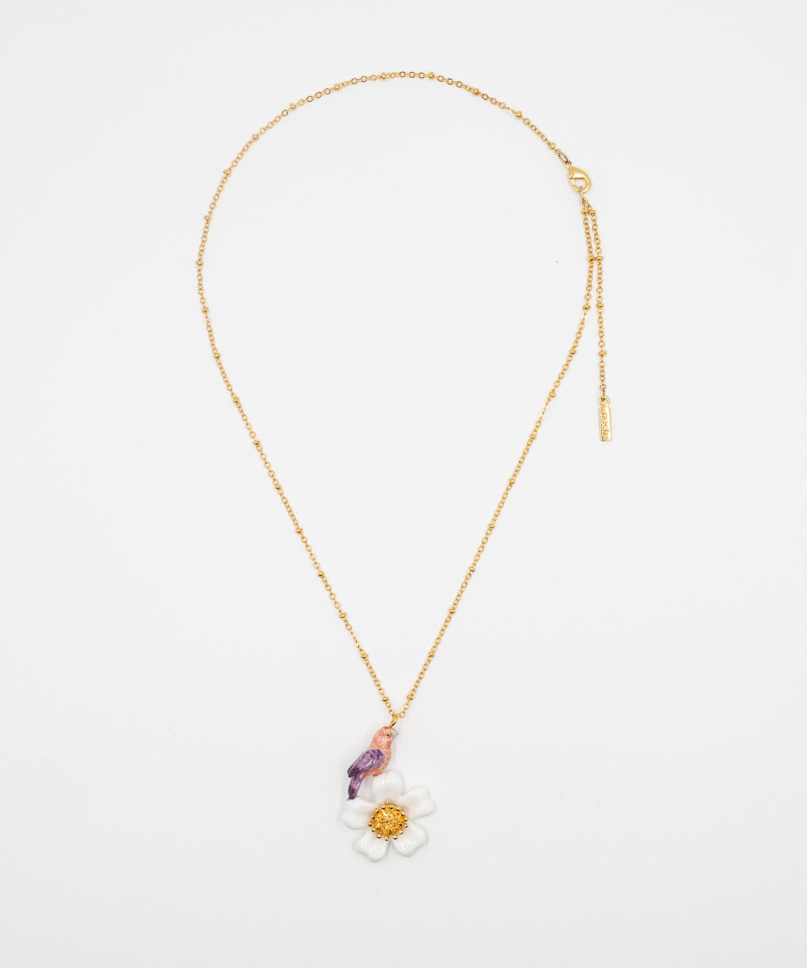 collier doré fleur blanche oiseau rose violet perroquet porcelaine