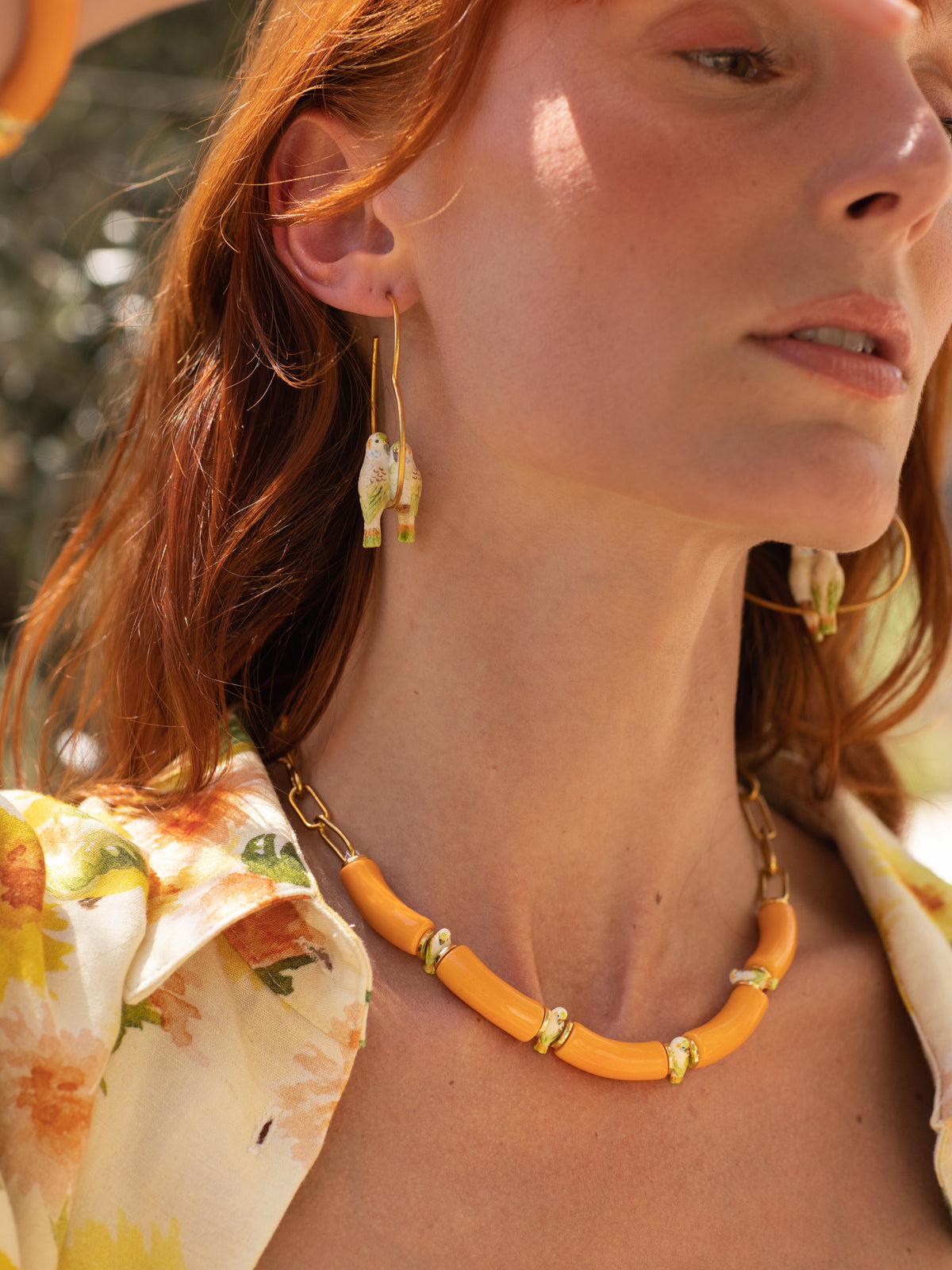 Collier perruches & perles oranges
